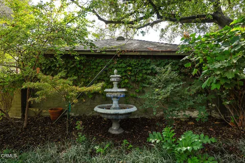 a swimming pool with outdoor seating and yard