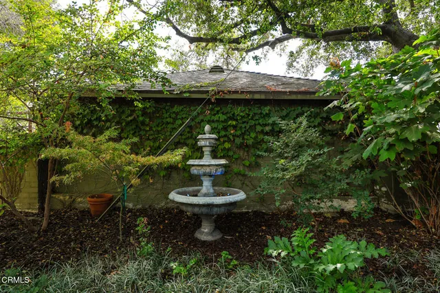 a swimming pool with outdoor seating and yard