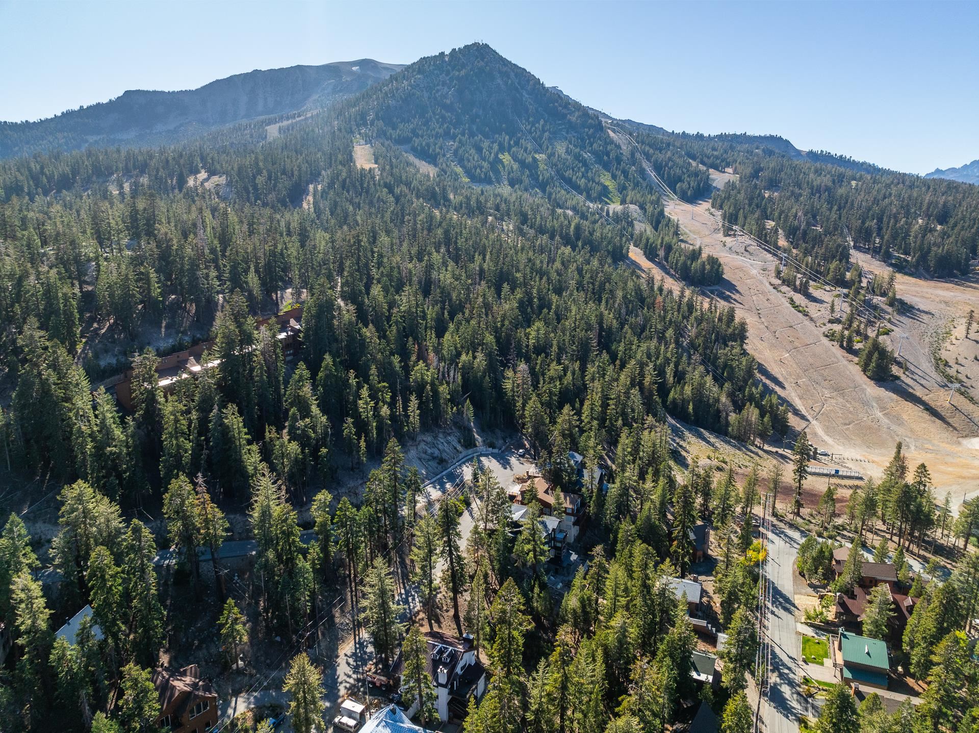 464 John Muir Road Mammoth Lakes, CA 93546 - Photo 22 of 27 a view of a house with a mountain in the background
