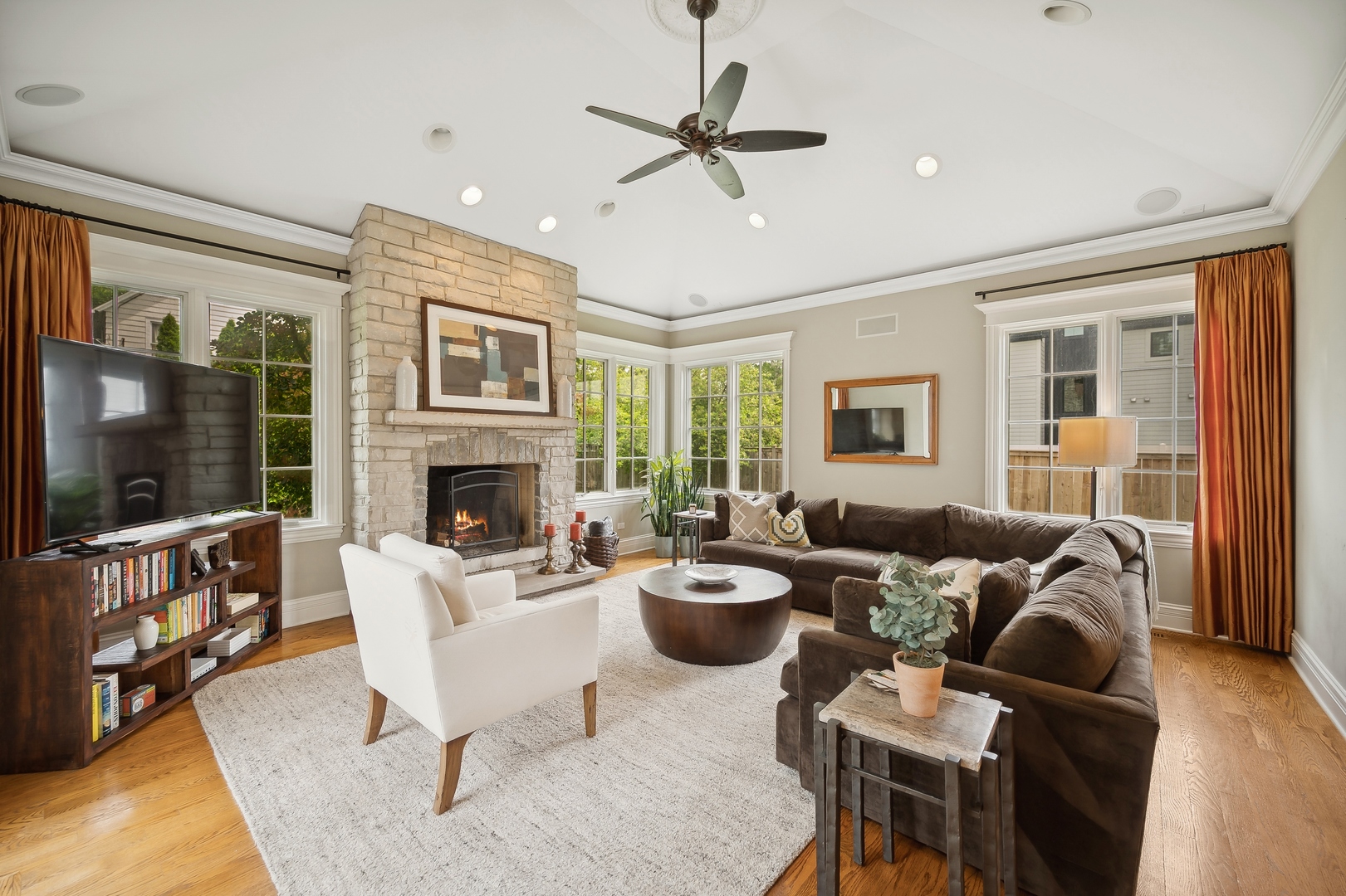 2548 Glenview Road Glenview, IL 60025 - Photo 15 of 39 a living room with furniture fireplace and a flat screen tv