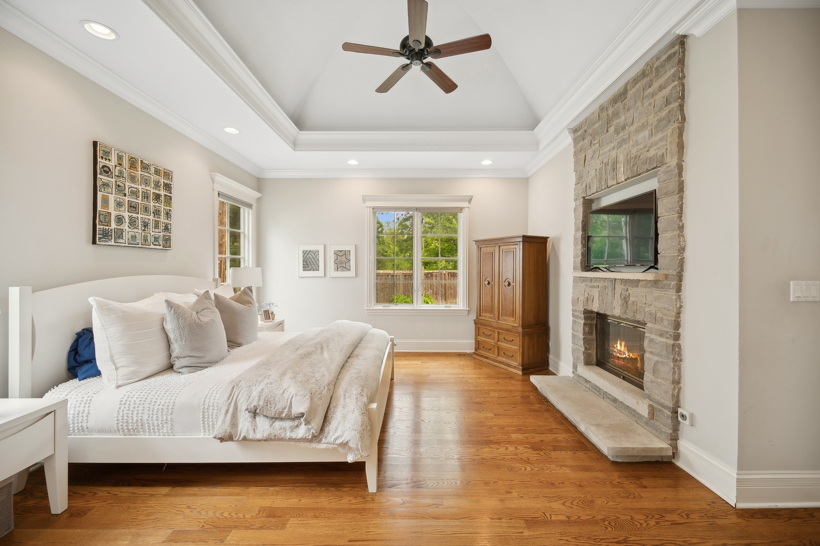2548 Glenview Road Glenview, IL 60025 - Photo 20 of 39 a spacious bedroom with a large bed a flat tv screen and dresser