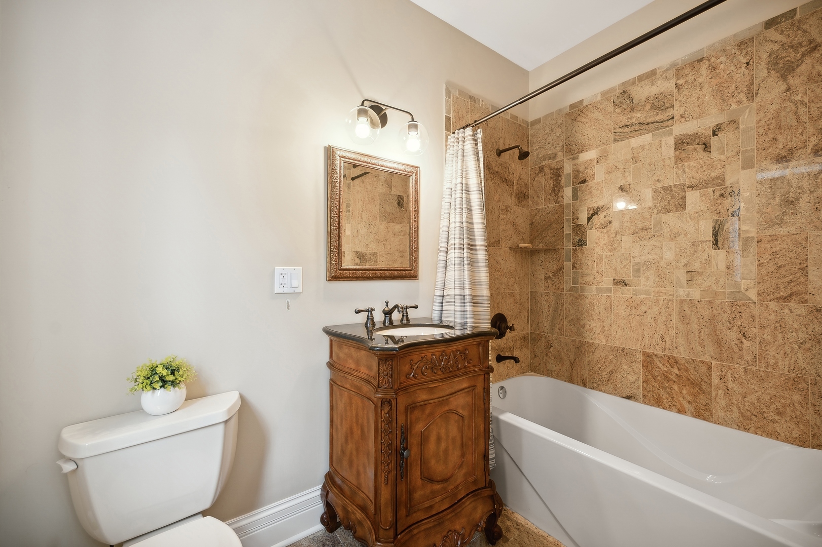 2548 Glenview Road Glenview, IL 60025 - Photo 25 of 39 a bathroom with a toilet a sink and bathtub