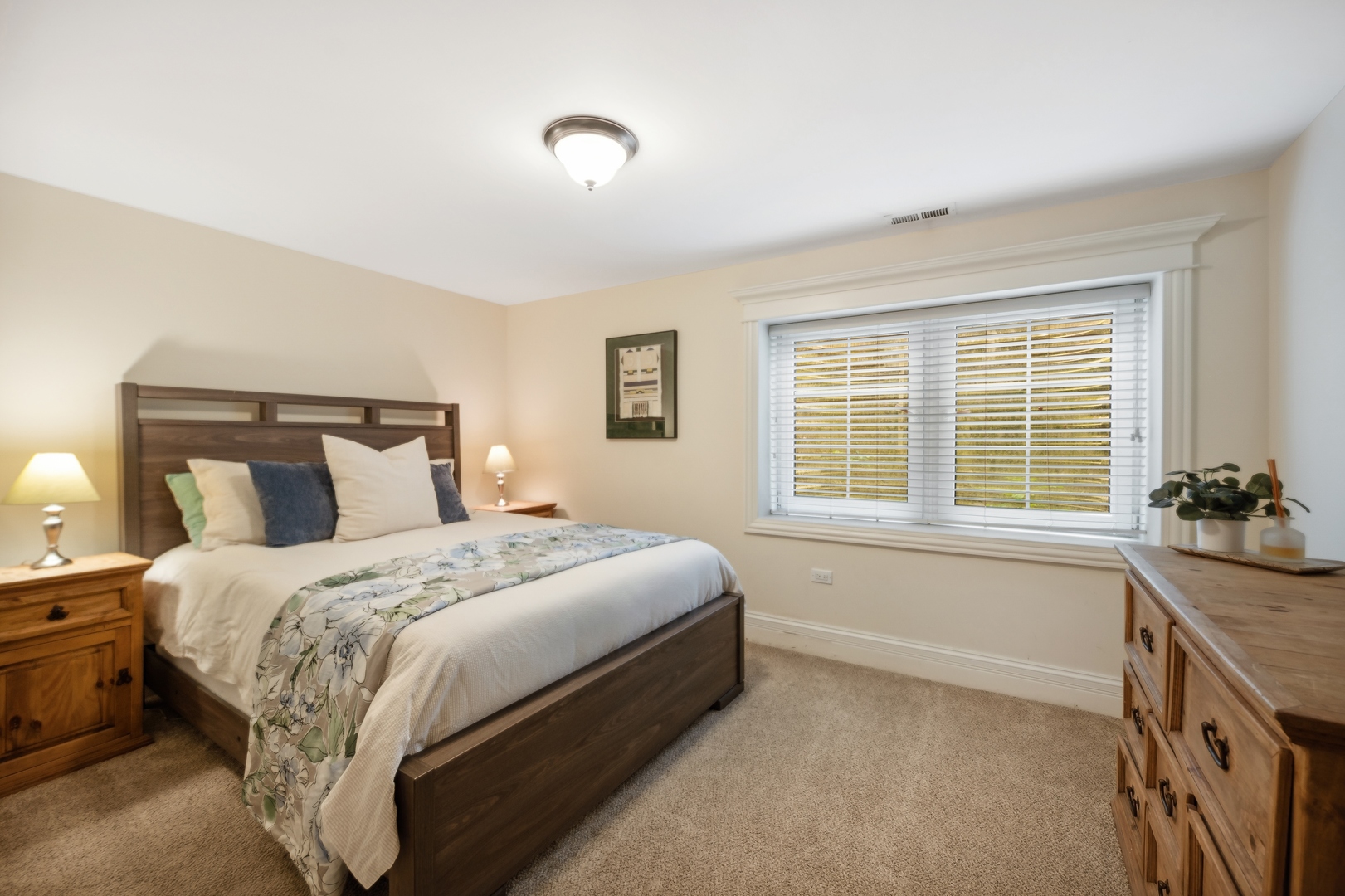 2548 Glenview Road Glenview, IL 60025 - Photo 31 of 39 a spacious bedroom with a bed and a large window