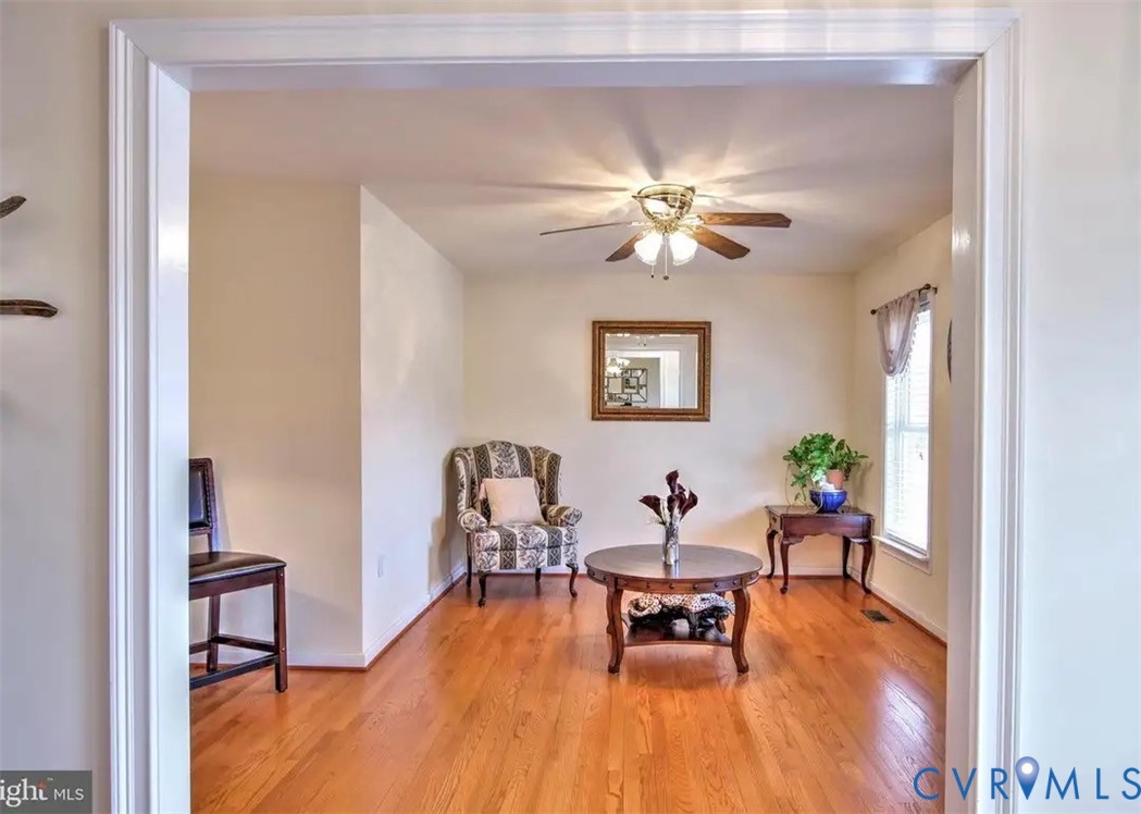 15390 Moores Mill Road Ruther Glen, VA 22546 - Photo 15 of 19 a living room with furniture and a chandelier