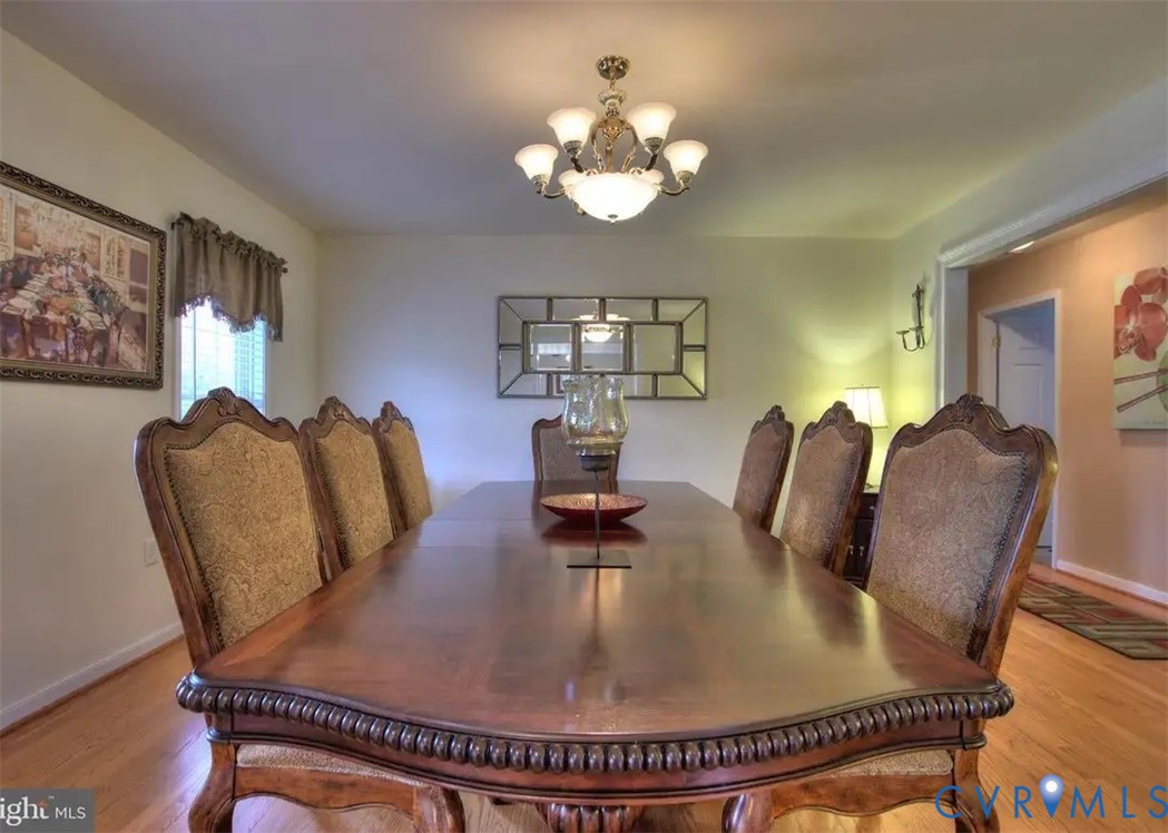 15390 Moores Mill Road Ruther Glen, VA 22546 - Photo 16 of 19 a dining room with furniture and chandelier