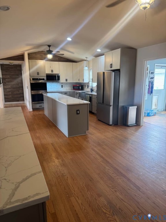 15390 Moores Mill Road Ruther Glen, VA 22546 - Photo 4 of 19 a large kitchen with stainless steel appliances kitchen island granite countertop a large cabinets a sink and a stove