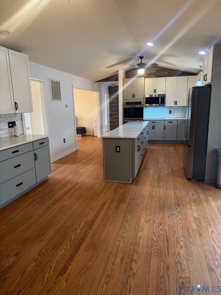 15390 Moores Mill Road Ruther Glen, VA 22546 - Photo 7 of 19 Kitchen with gray cabinetry, tasteful backsplash,