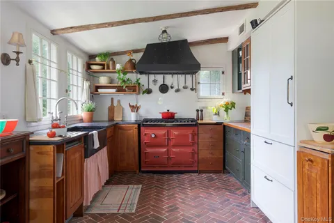 a kitchen with stainless steel appliances granite countertop a refrigerator and a stove