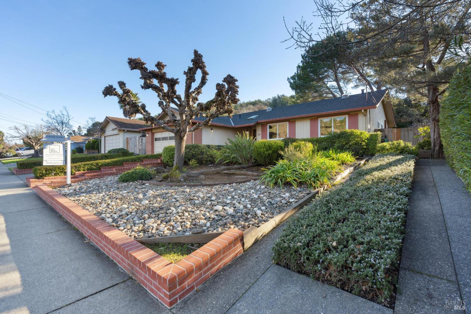 561 Olive Avenue Novato, CA 94945 - Photo 2 of 50 a front view of a house with garden