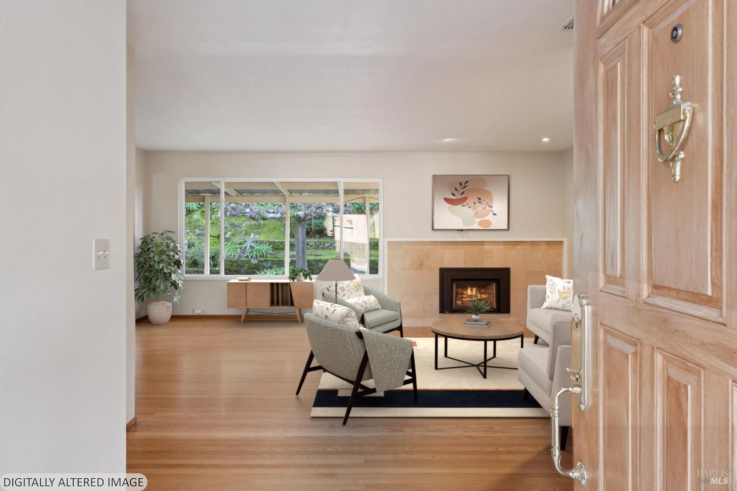 561 Olive Avenue Novato, CA 94945 - Photo 4 of 50 a living room with furniture and a fireplace