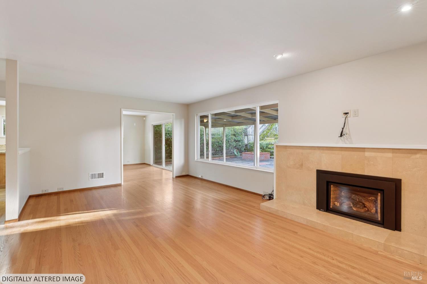 561 Olive Avenue Novato, CA 94945 - Photo 50 of 50 a view of an empty room with wooden floor fireplace and a window