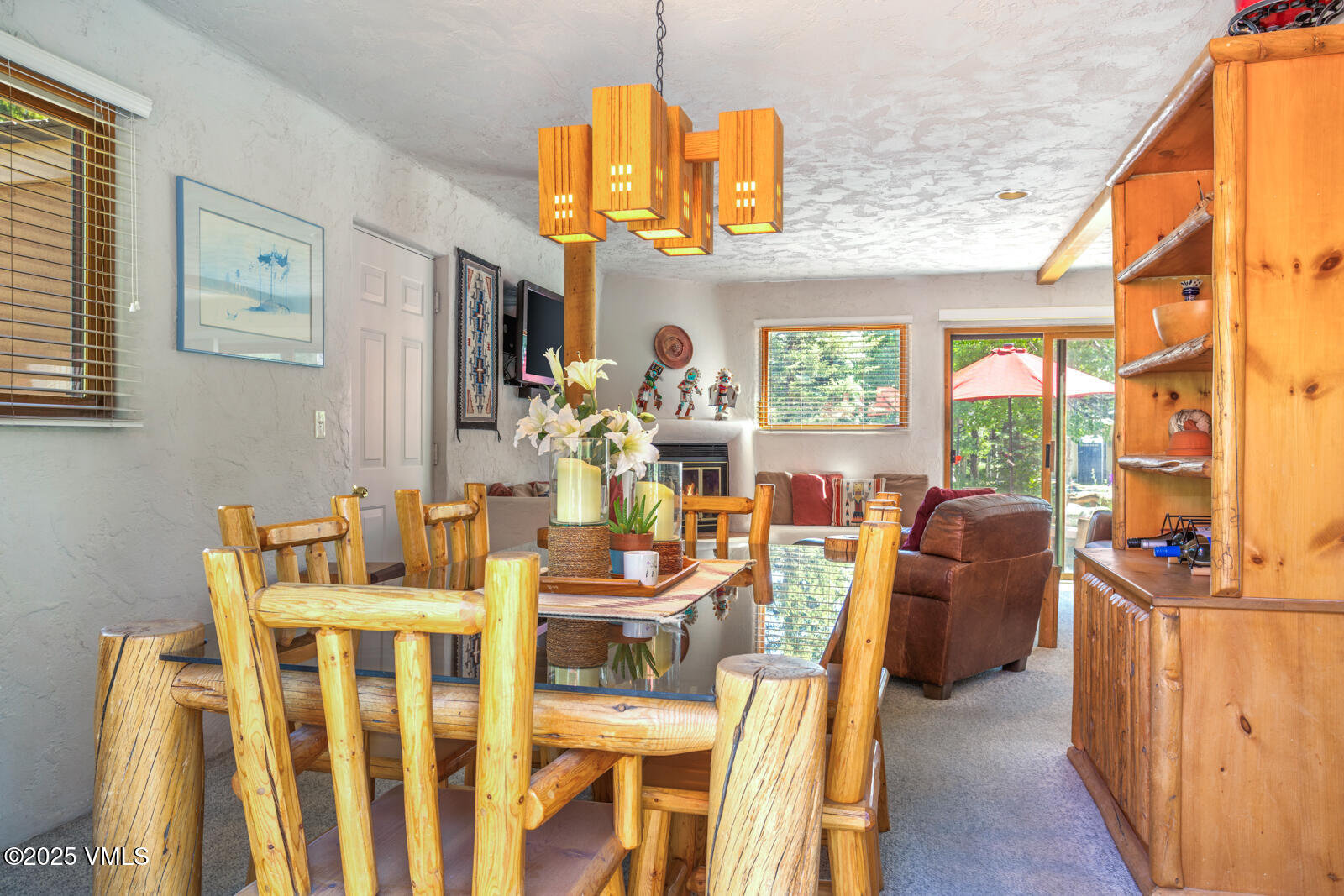 20 Hereford Road Edwards, CO 81632 - Photo 5 of 32 a dining room with furniture a chandelier and wooden floor