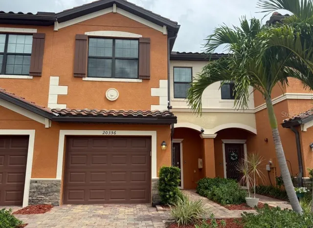 a front view of a house with yard