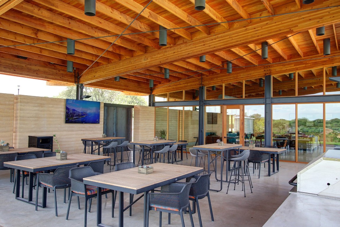532 Summer Pl Lane Georgetown, TX 78628 - Photo 12 of 20 a group of people sitting at tables in a patio