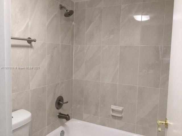 9225 Collins Avenue, Unit 403 Surfside, FL 33154 - Photo 11 of 19 a bathroom with a toilet and a shower