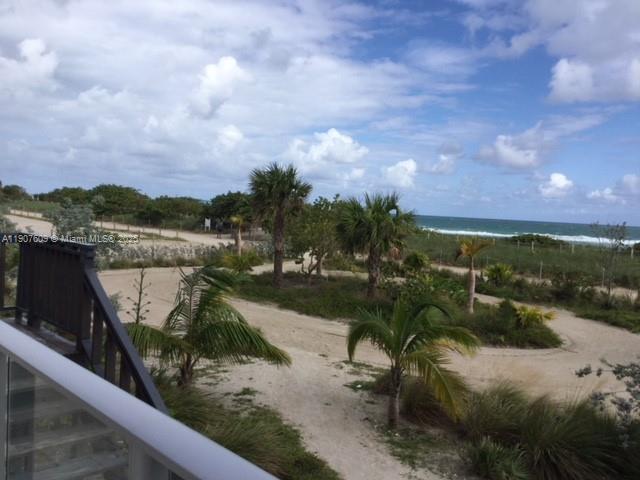 9225 Collins Avenue, Unit 403 Surfside, FL 33154 - Photo 16 of 19 a view of a lake with a mountain in the background