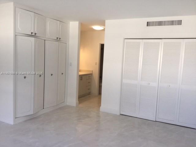 9225 Collins Avenue, Unit 403 Surfside, FL 33154 - Photo 9 of 19 a view of closet area