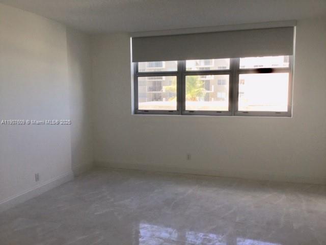 9225 Collins Avenue, Unit 403 Surfside, FL 33154 - Photo 10 of 19 an empty room with a window