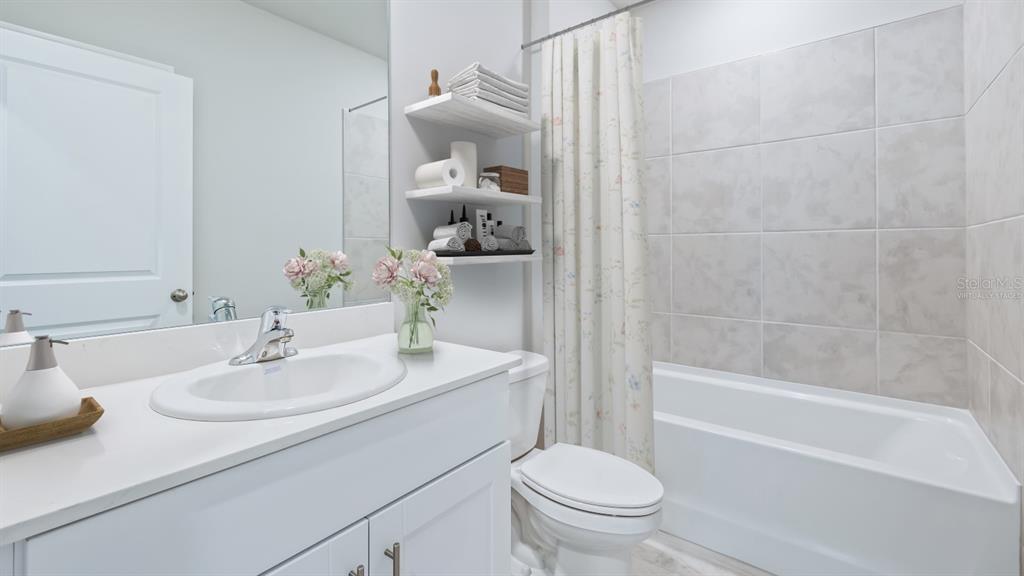 9450 Turtle Grass Circle Punta Gorda, FL 33950 - Photo 13 of 35 a bathroom with a sink toilet and shower