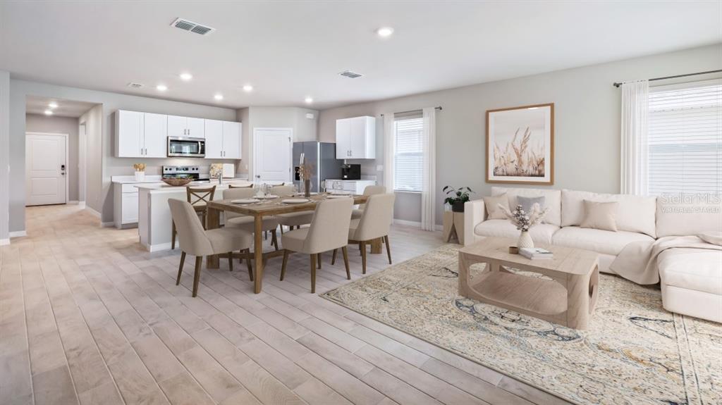 9450 Turtle Grass Circle Punta Gorda, FL 33950 - Photo 2 of 35 a view of a dining room with furniture window and wooden floor