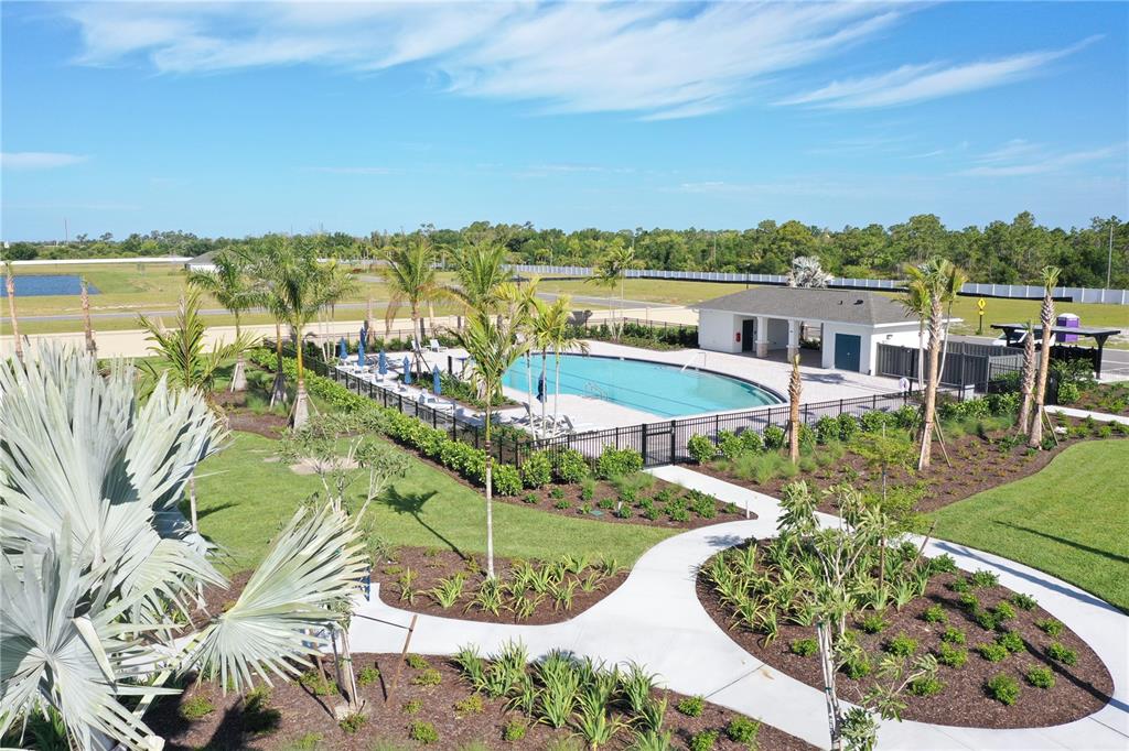 9450 Turtle Grass Circle Punta Gorda, FL 33950 - Photo 23 of 35 an aerial view of residential houses with outdoor space and swimming pool