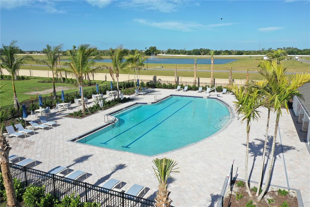9450 Turtle Grass Circle Punta Gorda, FL 33950 - Photo 29 of 35 a view of swimming pool with outdoor seating and lake