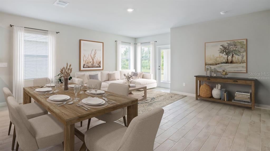 9450 Turtle Grass Circle Punta Gorda, FL 33950 - Photo 3 of 35 a dining room with furniture window and wooden floor