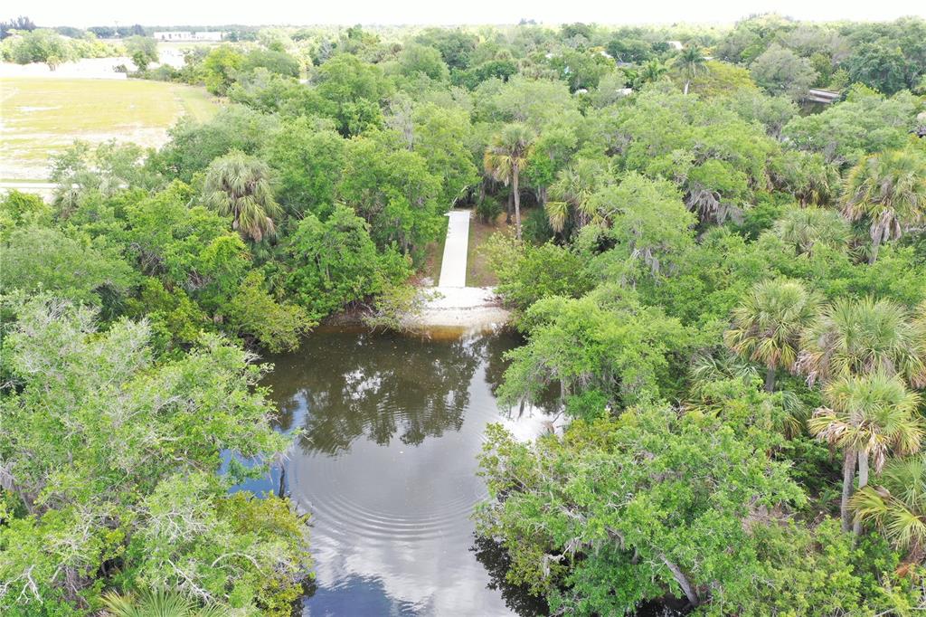 9450 Turtle Grass Circle Punta Gorda, FL 33950 - Photo 34 of 35 a view of a garden with a building