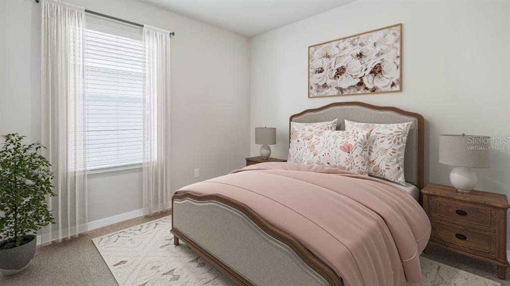 9450 Turtle Grass Circle Punta Gorda, FL 33950 - Photo 7 of 35 a bedroom with a bed and a painting on the wall