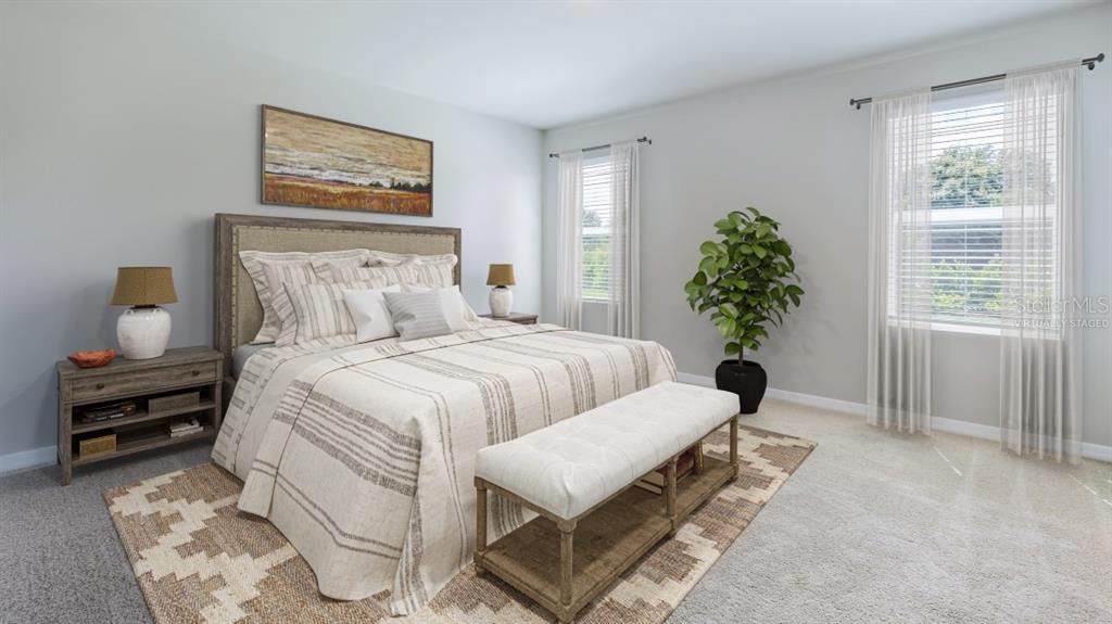 9450 Turtle Grass Circle Punta Gorda, FL 33950 - Photo 10 of 35 a bedroom with furniture and a window