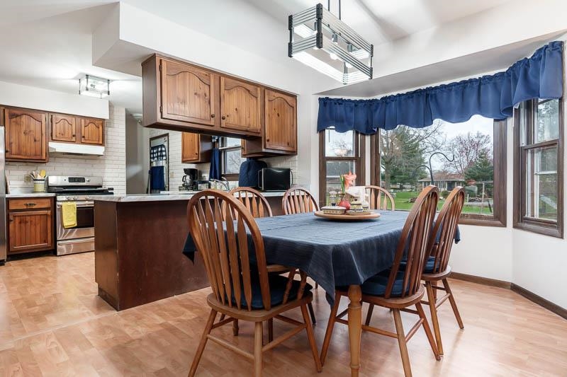 3824 Valerie Road Roscoe, IL 61073 - Photo 11 of 33 a view of a dining room with furniture window and wooden floor