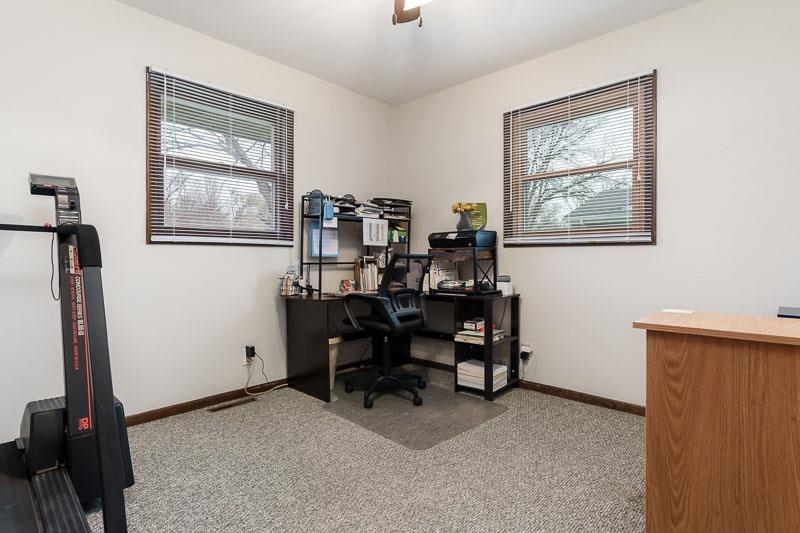 3824 Valerie Road Roscoe, IL 61073 - Photo 20 of 33 a view of a workspace with furniture and a window