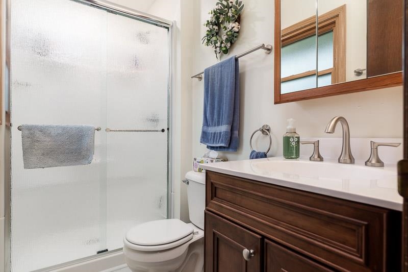 3824 Valerie Road Roscoe, IL 61073 - Photo 25 of 33 a bathroom with a sink a toilet and shower
