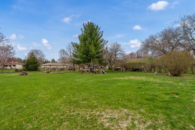 3824 Valerie Road Roscoe, IL 61073 - Photo 27 of 33 a view of yard with swimming pool and green space