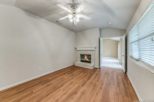 a kitchen with granite countertop stainless steel appliances and white cabinets