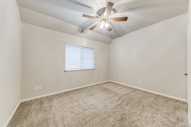 a spacious bathroom with a double vanity sink a mirror and a shower