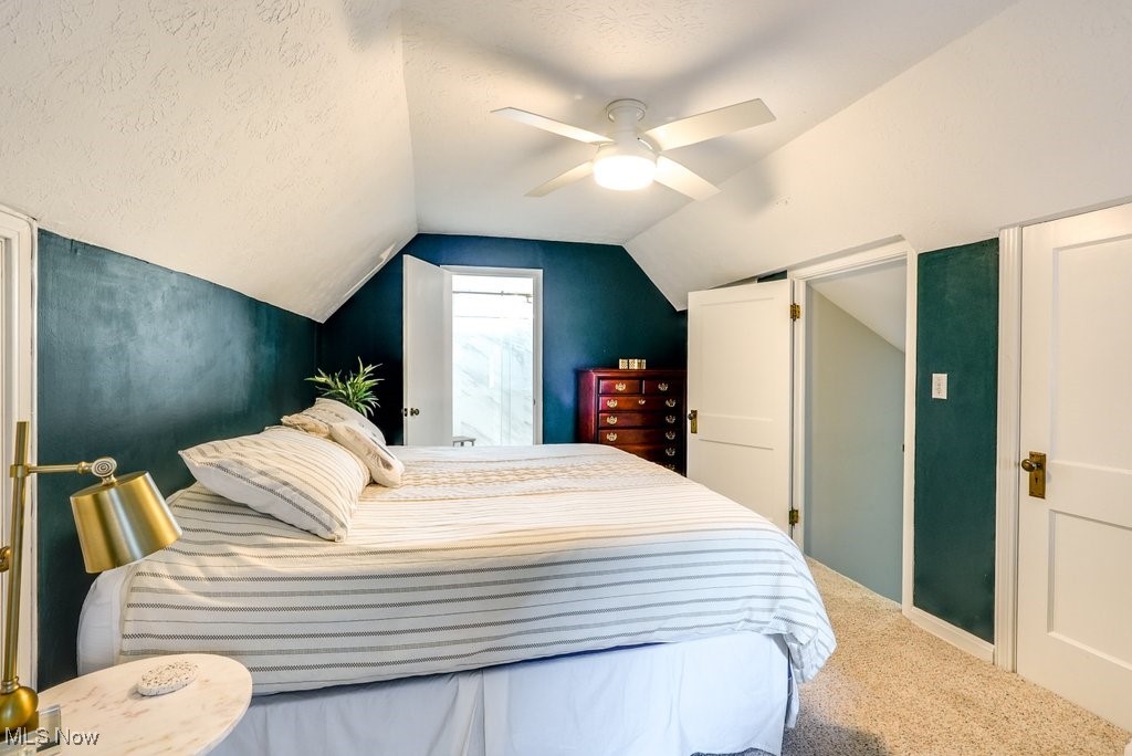 2340 Canterbury Road University Heights, OH 44118 - Photo 23 of 29 Bedroom with carpet floors, a textured ceiling, ceiling fan, and lofted ceiling