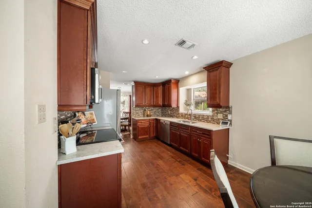 a large room with kitchen island granite countertop lots of counter top space