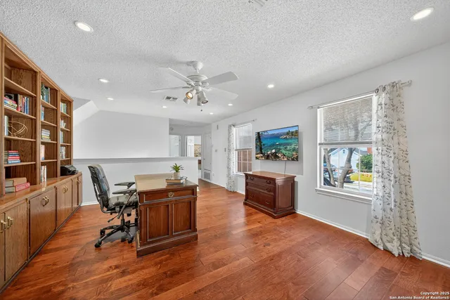 a view of a livingroom with furniture and a kitchen