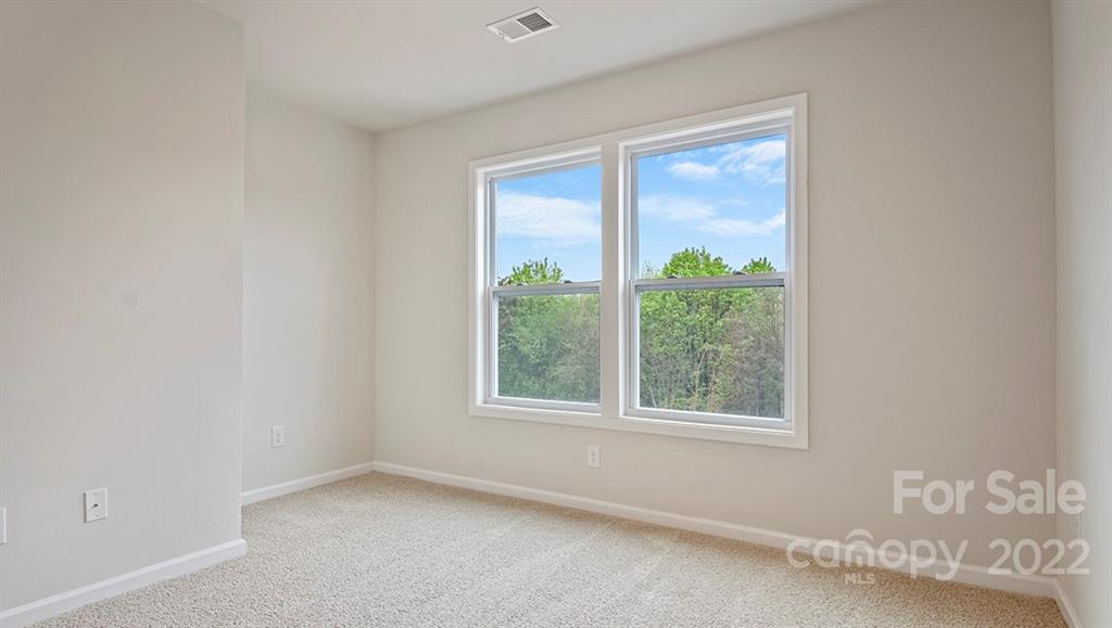 67 Creekview Road Hendersonville, NC 28792 - Photo 18 of 25 an empty room with a window