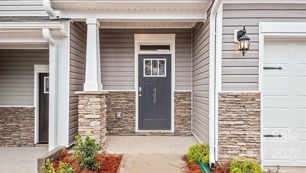 67 Creekview Road Hendersonville, NC 28792 - Photo 3 of 25 a front view of a house with a yard