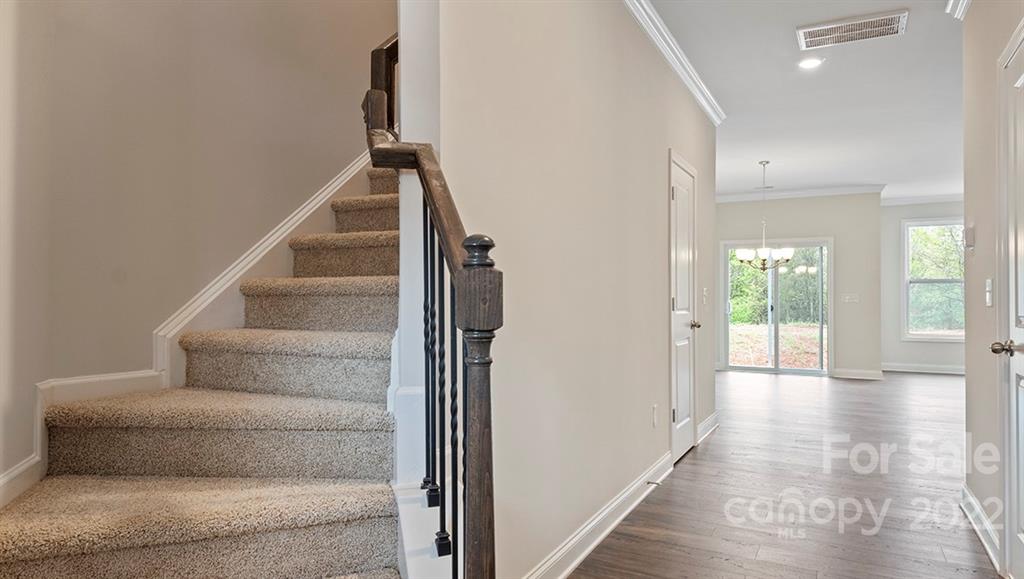 67 Creekview Road Hendersonville, NC 28792 - Photo 4 of 25 a view of an entryway with wooden floor and a rug