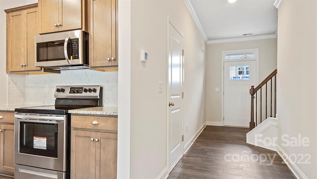 67 Creekview Road Hendersonville, NC 28792 - Photo 5 of 25 a kitchen with stainless steel appliances granite countertop a refrigerator stove and microwave