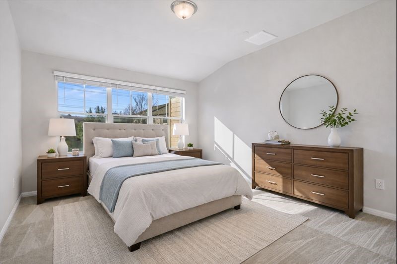 516 East Slaughter Lane, Unit 604 Austin, TX 78744 - Photo 19 of 35 a bedroom with a bed and a dresser