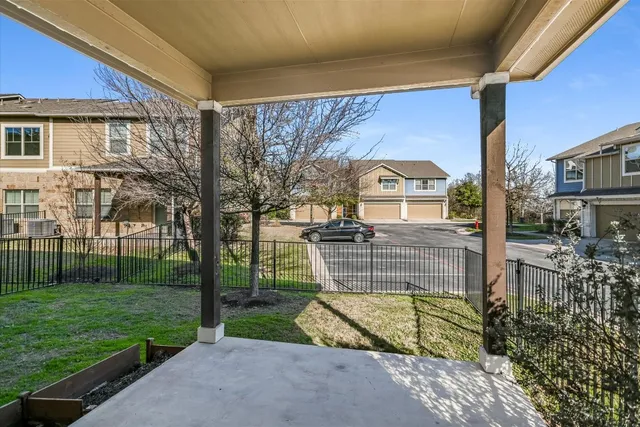 a front view of a house with a yard table and chairs