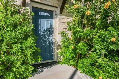 view of a house with a tree