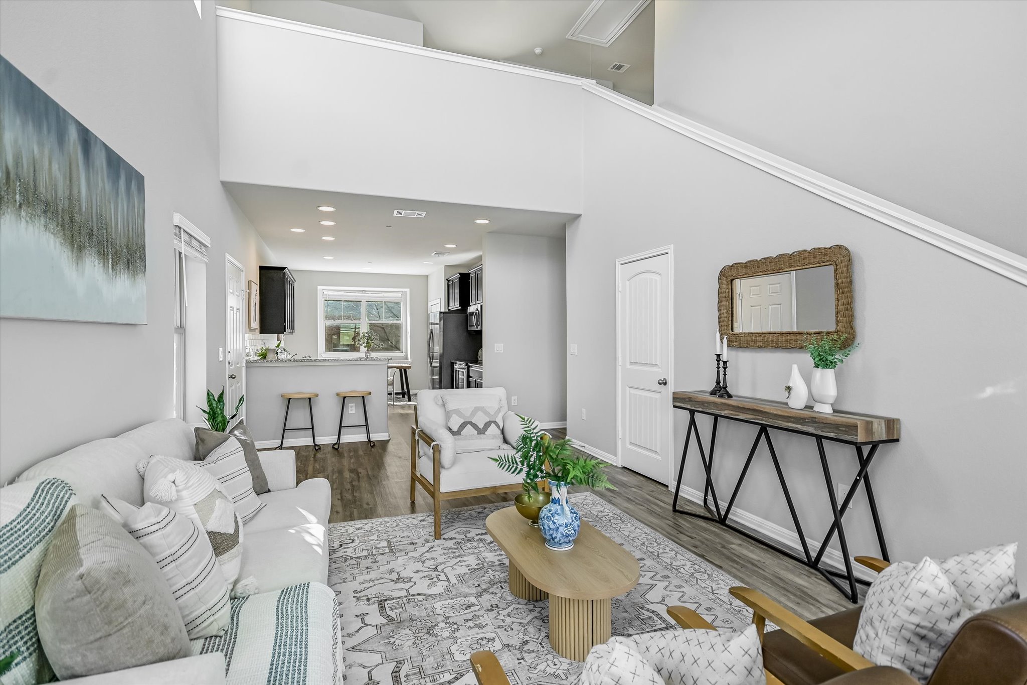 516 East Slaughter Lane, Unit 604 Austin, TX 78744 - Photo 7 of 35 a living room with furniture and a wooden floor