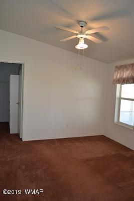 735 2300 North Snowflake, AZ 85937 - Photo 17 of 59 an empty room with a window and a ceiling fan