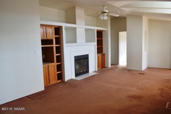 735 2300 North Snowflake, AZ 85937 - Photo 2 of 59 a view of a livingroom with an empty space and a fireplace