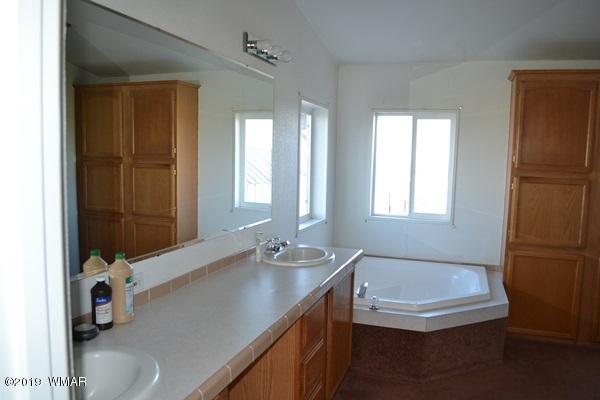 735 2300 North Snowflake, AZ 85937 - Photo 9 of 59 a bathroom with a tub sink and mirror